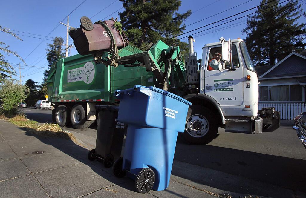 A garbage truck picks up yard waste in Santa Rosa. (PD FILE, 2011)