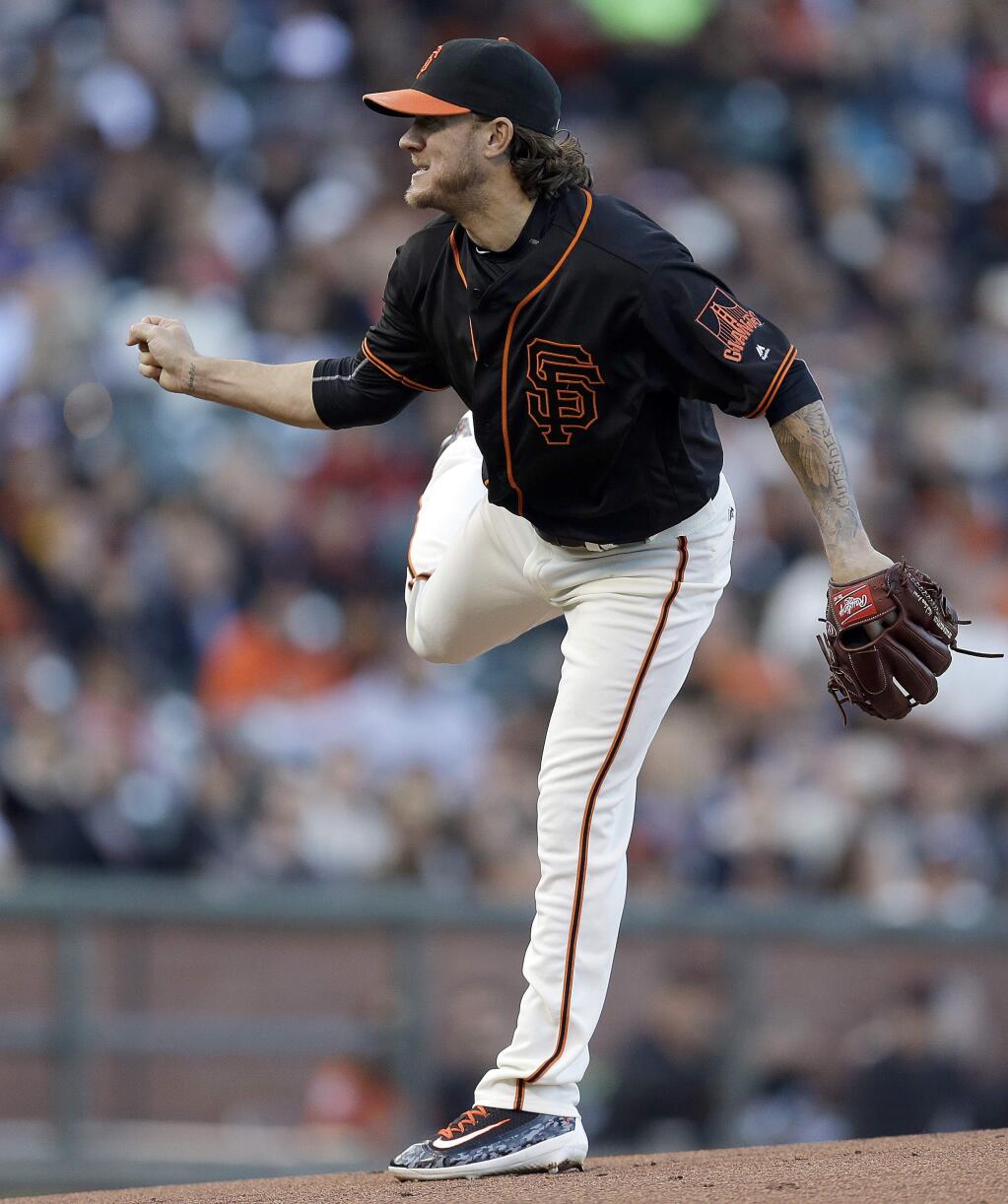 San Francisco Giants pitcher Jake Peavy works watches a delivery to the Miami Marlins during the first inning of a baseball game Saturday, April 23, 2016, in San Francisco. (AP Photo/Ben Margot)