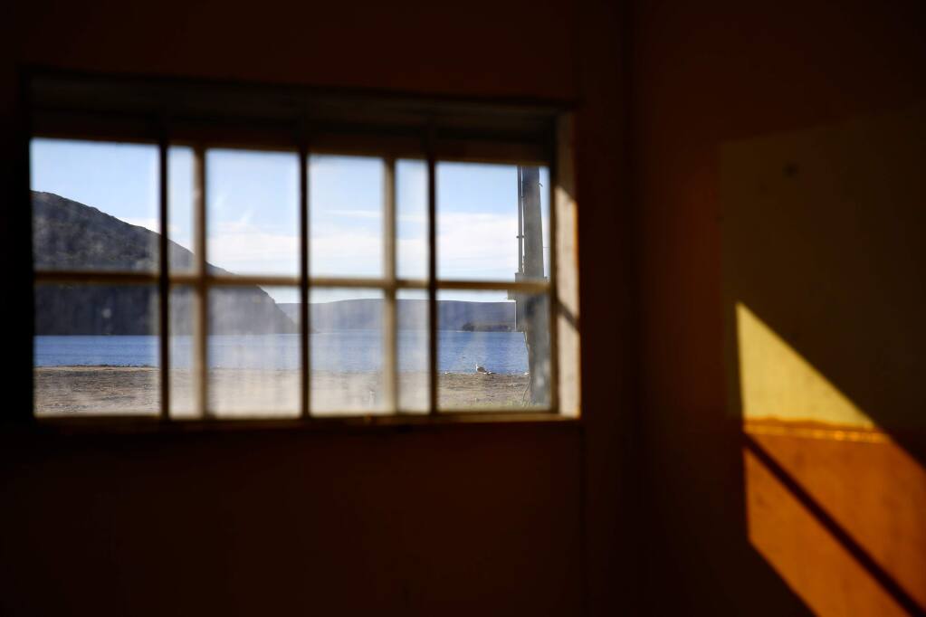 Sunlight comes through a window of the now closed Drake's Bay Oyster Co. on Wednesday, January 7, 2015 near Inverness, California . (BETH SCHLANKER/ The Press Democrat)