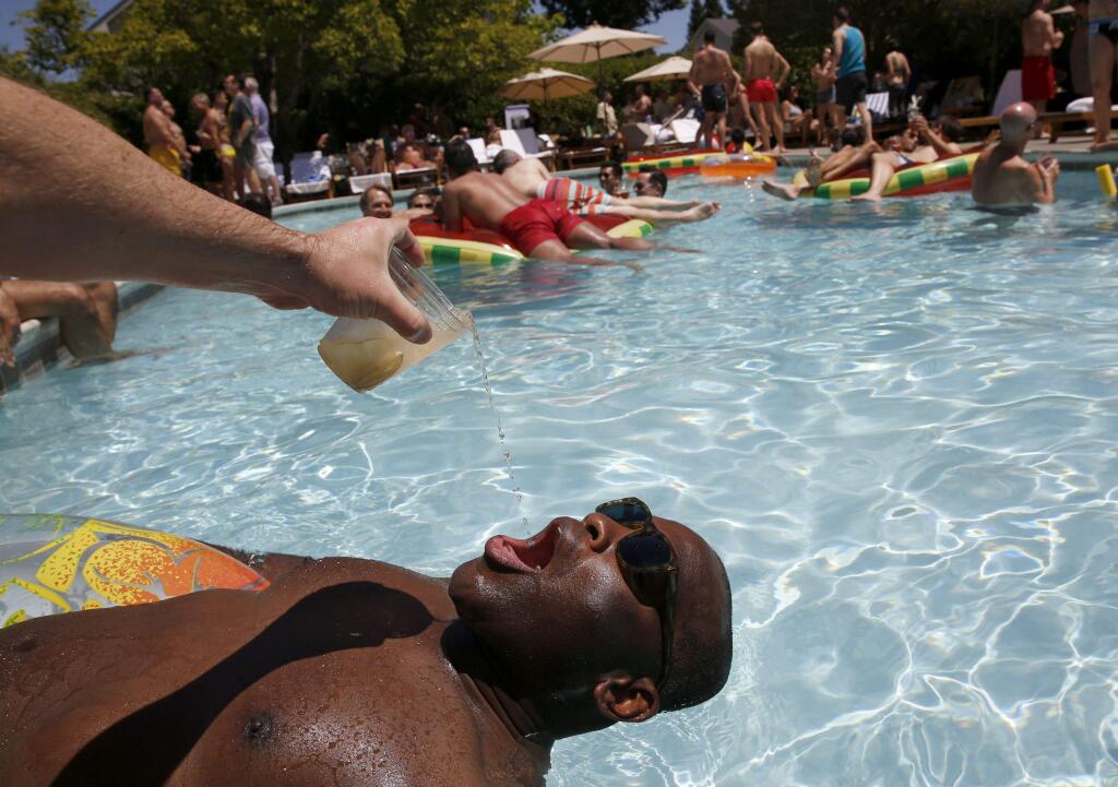 Michael Tate enjoyed great pool-side service at last years Gay Wine Weekend at MacArthur Place.(Beth Schlanker/ Press Democrat)