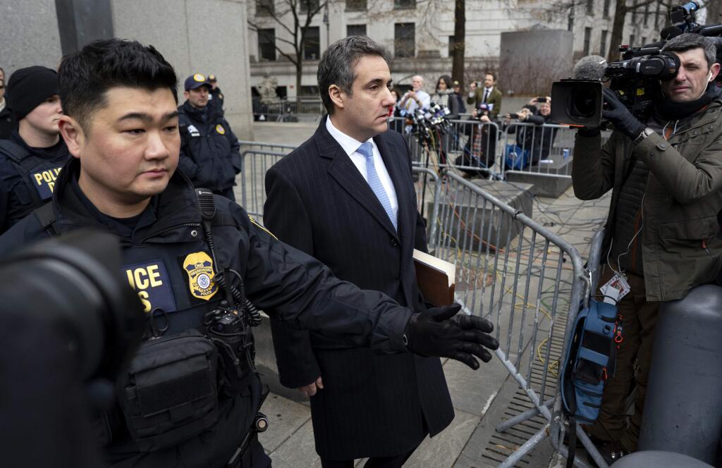 In this Dec. 12, 2018, photo, Michael Cohen, President Donald Trump's former lawyer, leaves federal court after his sentencing in New York. Trump has gone from denying knowledge of any payments to women who claim to have been mistresses to apparent acknowledgement of those hush money settlements – though he claims they wouldn't be illegal. (AP Photo/Craig Ruttle)