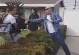 A screen grab from a YouTube video shows an off-duty Los Angeles police officer fighting with teens in Anaheim, where the officer lives, on Wednesday.