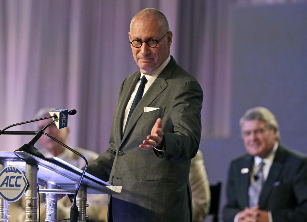 FILE - In this July 21, 2016 file photo, ESPN president John Skipper gestures as he talks about the new ACC/ESPN Network during a news conference at the Atlantic Coast Conference Football Kickoff in Charlotte, N.C. Skipper says he is resigning to take care of a substance abuse problem. The sports network says its former president, George Bodenheimer, will take over as acting head of the company for the next 90 days. (AP Photo/Chuck Burton, File)