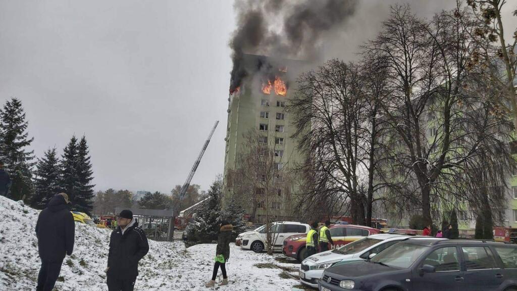 A fire burns as a gas explosion severely damaged a 12th storey apartment building in Presov, Slovakia, Friday, Dec. 6, 2019. The firefighters said the explosion occurred between the ninth and 12th storey and witnesses told them several people have escaped to the roof. Authorities didn't immediately confirm any injuries or fatalities.(AP Photo/Police of Slovakia/HO)
