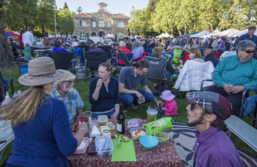 The first Tuesday Night Farmers Market of the season is usually a big, crowded party and the May 1st event was no exception. Attendees either brought or purchased drinks and food, and settled in to enjoy the collective bonhomie, the music and the magic of the evening. (Photo by Robbi Pengelly/Index-Tribune)