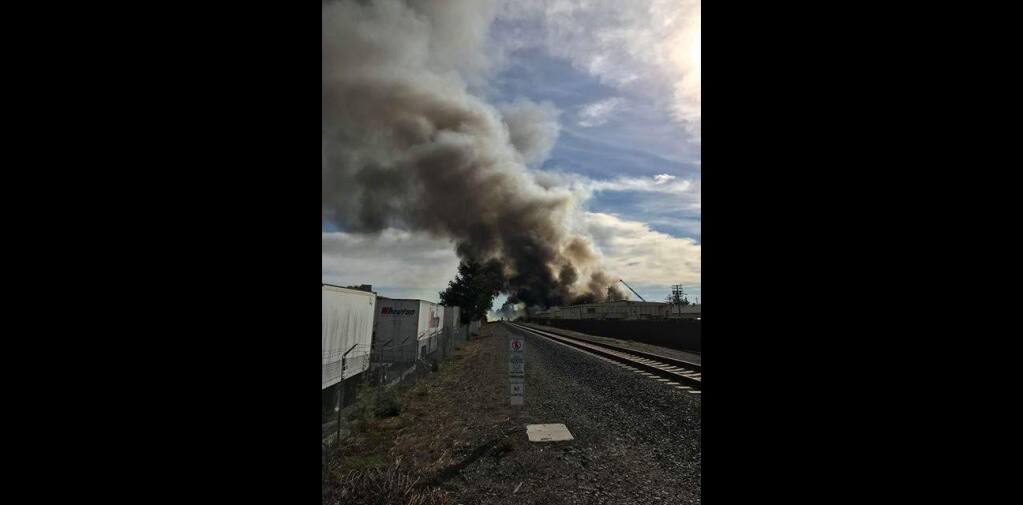 Early reports indicates a fire Saturday afternoon at a garbage collection service building in south Santa Rosa, according emergency personnel. (Cameron Corser)