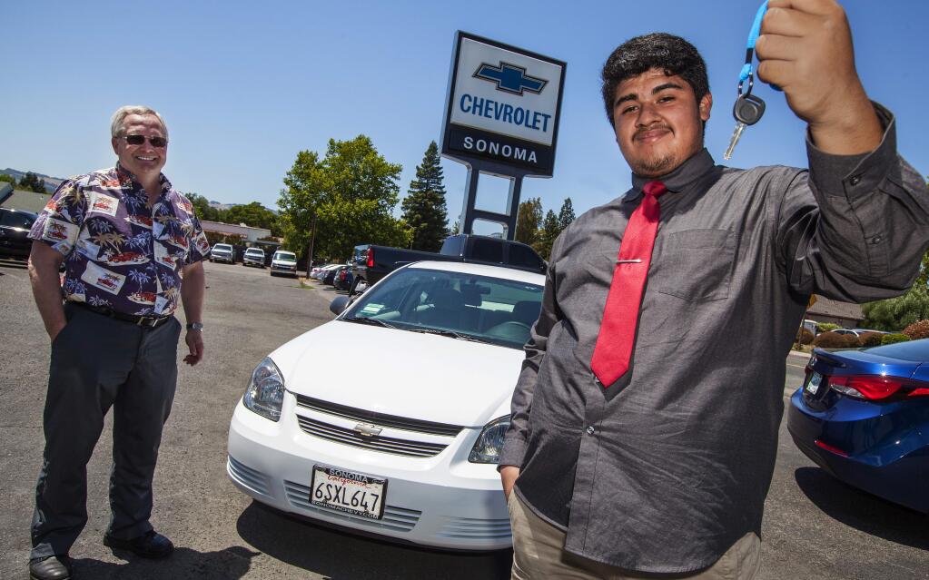 Robbi Pengelly/Index-TribuneAlberto Soriano-Morales, 17, will now be able to drive to his chemistry classes at Sonoma State this fall, thanks to winning the raffle for a 2009 Chevy Cobalt at this year's Sonoma Valley High School's Grad Night party. The car was donated by Dan Roseland of Sonoma Chevrolet.