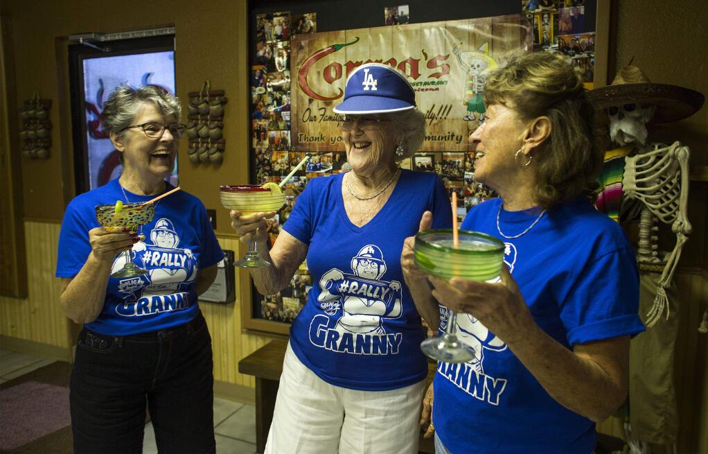 Betty True of Fort Mohave, Ariz., middle, spends time with friends at her favorite local Mexican restaurant where 'Rally Granny' T-shirts are popular on August 7, 2017, in Fort Mohave. True lifted her shirt and flashed the crowd while being shown on the video board at a recent Dodgers game. From the left: Betty Pozenel, True, and Georgia Weaver, right. (Gina Ferazzi/Los Angeles Times/TNS)