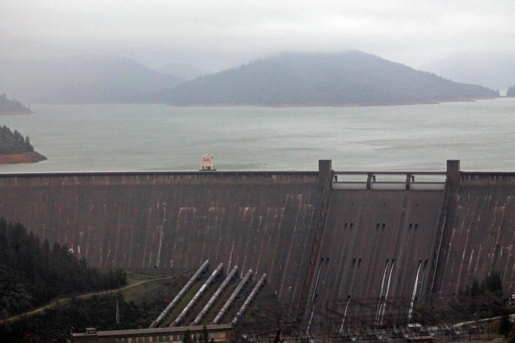Lake Shasta behind Shasta Dam in Lake Shasta, Calif., is seen Sunday, March 13, 2016. The lake's water level has been rising after a series of storms brought strong winds, periods of heavy rain, snow and high surf to California Sunday, the fourth straight day of wet weather. The lake is rising after several years of dropping water levels due to the ongoing California drought.(Nathan Solis/The Record Searchlight via AP)