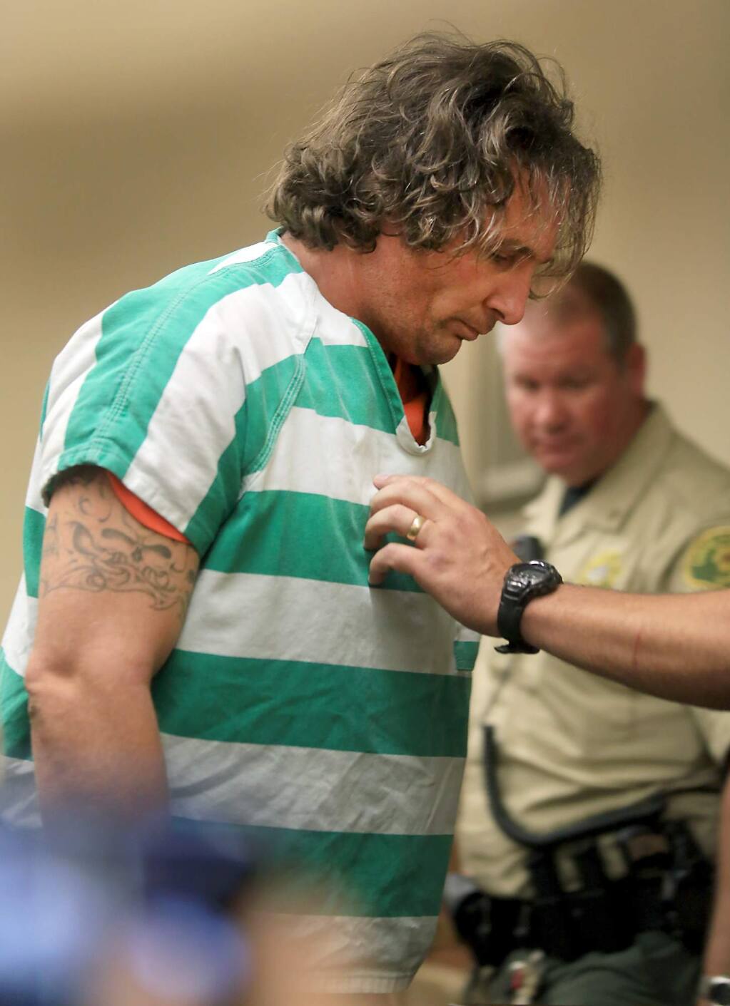 Damin Pashilk, 40, is taken from Lake County Superior Court, Wednesday August 17, 2016 after facing charges of arson in setting the Clayton fire in Lower Lake in Lake County. He did not enter a plea and the case was set over until September. Pashilk is resident of Lake County and faces numerous counts of arson dating back to 2015. (Kent Porter / Press Democrat) 2016