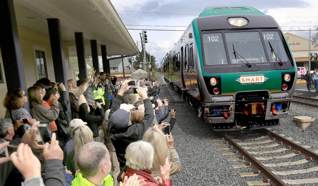 A SMART commuter train, Tuesday April 7, 2015 pulls in to the Cotati train depot, for an official unveiling of the train cars. (Kent Porter / Press Democrat) 2015