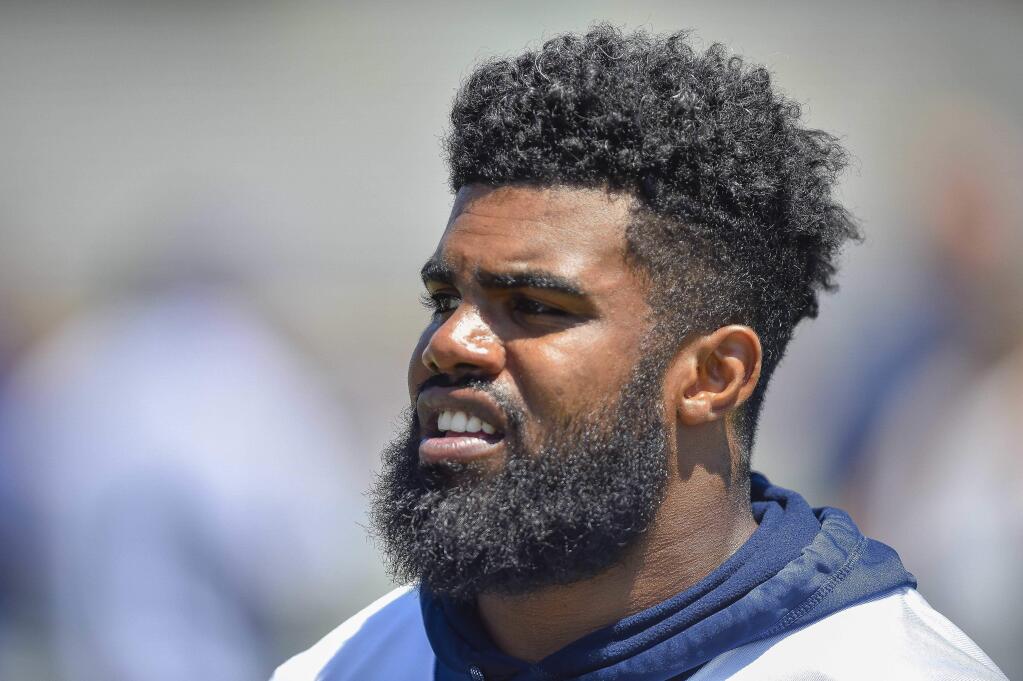 FILE - This is a July 25, 2017, file photo showing Dallas Cowboys running back Ezekiel Elliott during NFL football training camp in Oxnard, Calif. The NFL Players Association has appealed Dallas Cowboys running back Ezekiel Elliott's six-game suspension over the league's conclusion that its 2016 rushing leader injured his former girlfriend in three separate incidents last summer. The union said Tuesday, Aug. 15, 2017, it will represent Elliott 'to ensure that the NFL is held to its obligation of adhering to principles of industrial due process under the collective bargaining agreement.' (AP Photo/Gus Ruelas, File)