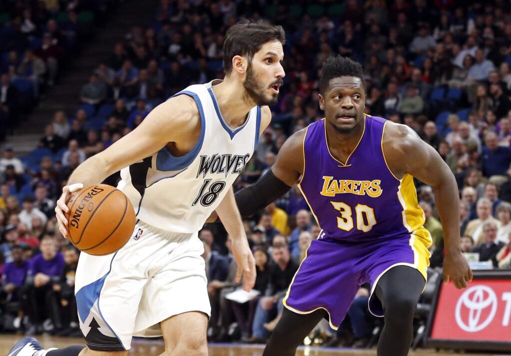 The Minnesota Timberwolves' Omri Casspi, left, drives past the Los Angeles Lakers' Julius Randle during the first half Thursday, March 30, 2017, in Minneapolis. (AP Photo/Jim Mone)