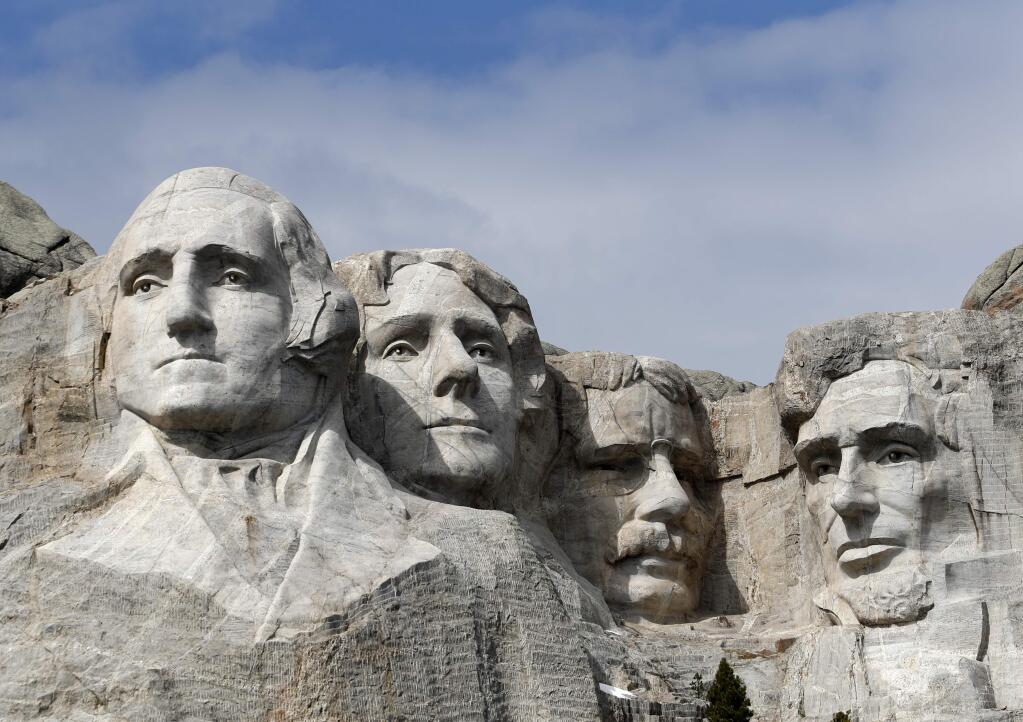 FILE - This March 22, 2019 file photo shows Mount Rushmore in Keystone, S.D. A Nebraska woman has been fined $1,000 for climbing the memorial. Authorities say Alexandria Incontro scaled the massive granite sculpture Friday, July 12, 2019 with bare feet and no rope, making it to about 15 feet (4.5 meters) from the top. (AP Photo/David Zalubowski, File)