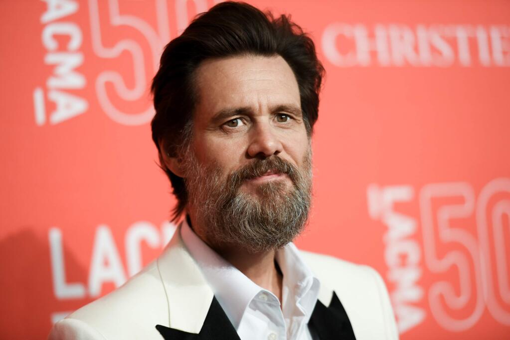 FILE - In this April 18, 2015 file photo, Jim Carrey arrives at LACMA's 50th Anniversary Gala in Los Angeles. Carrey says he was shocked and saddened to learn of the death of ex-girlfriend Cathriona White, likening the news to being hit by a lightning bolt. The 30-year-old makeup artist was found dead in her Sherman Oaks apartment on Monday, Sept. 28, according to the Los Angeles County Coroners Office. Her death is being investigated as a possible suicide in the ongoing case with an examination scheduled for Wednesday. (Photo by Richard Shotwell/Invision/AP, File)