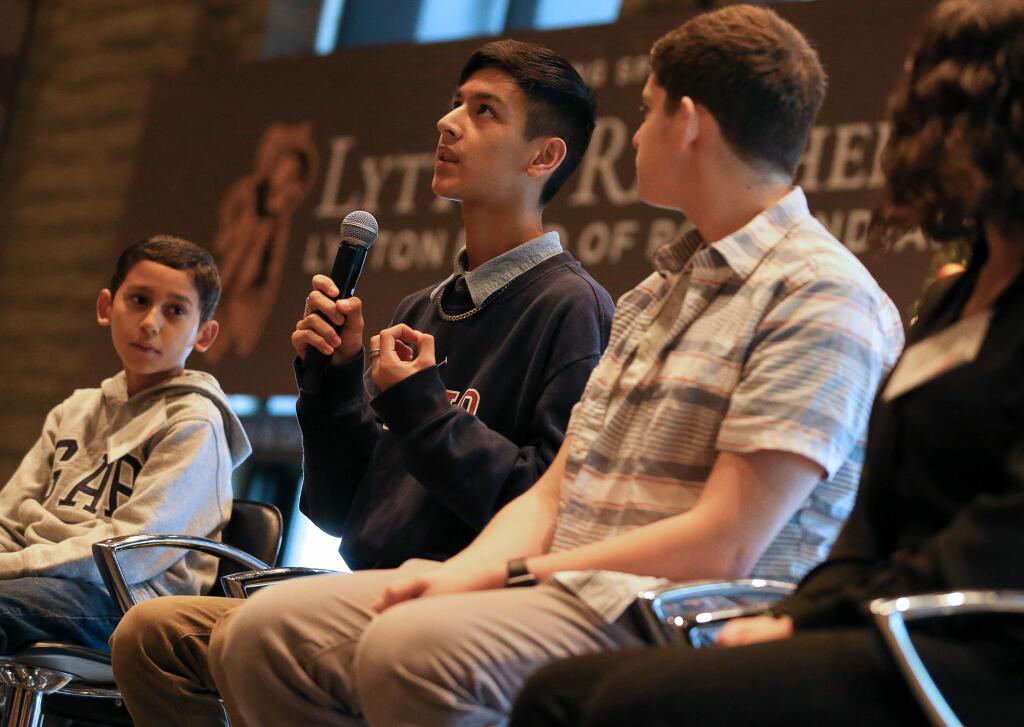 Windsor High School student Moises Sanchez, center, talks about how art has impacted his life, during the Sonoma County Arts Education Framework breakfast event, at the Luther Burbank Center for the Arts, in Santa Rosa on Thursday, December 12, 2019. (Christopher Chung/ The Press Democrat)