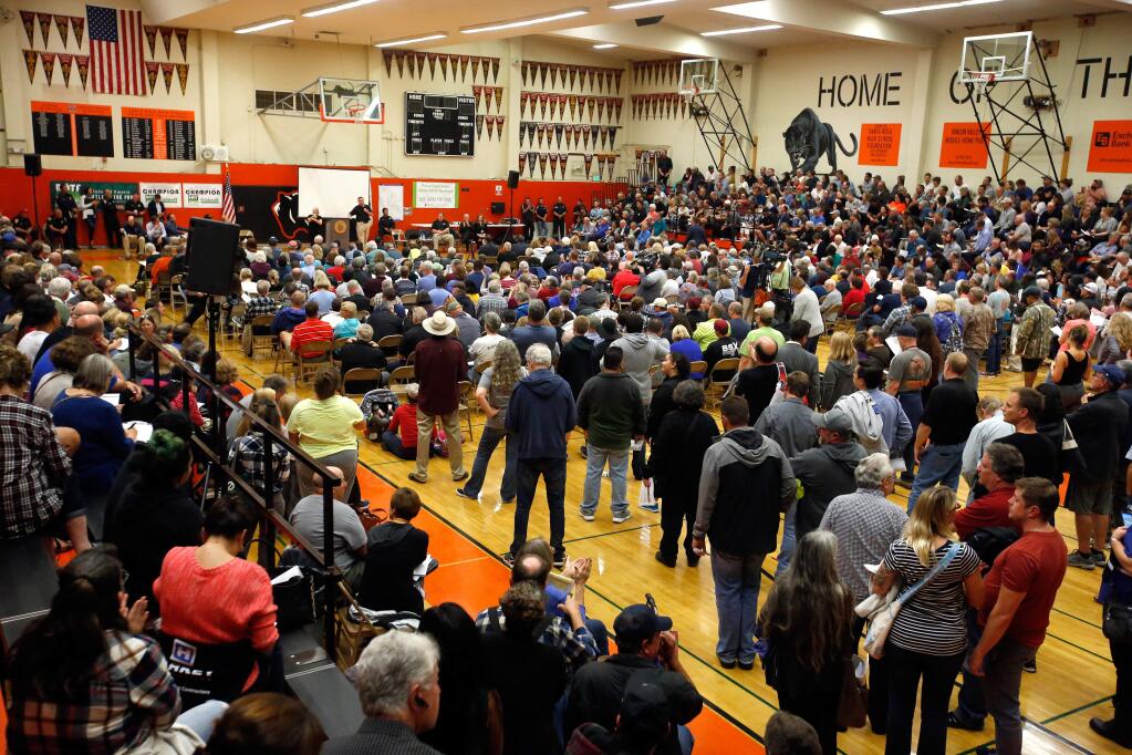 Hundreds of displaced residents attend a community meeting at Santa Rosa High School in Santa Rosa, California, on Thursday, October 19, 2017. (Alvin Jornada / The Press Democrat)