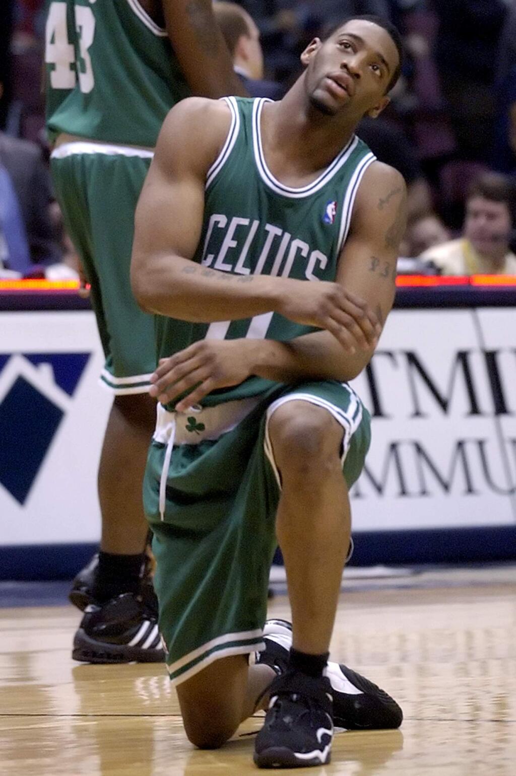FILE - In this April 16, 2006 file photo, Boston Celtics' Orien Greene reacts after he fell and lost the ball during an NBA basketball game against the New Jersey Nets in East Rutherford, N.J. Greene has been arrested after being accused of breaking into two Florida homes and fondling a woman. News outlets report Greene was taken into custody Monday, Jan. 9, 2017 on battery and burglary charges. (AP Photo/Bill Kostroun, File)