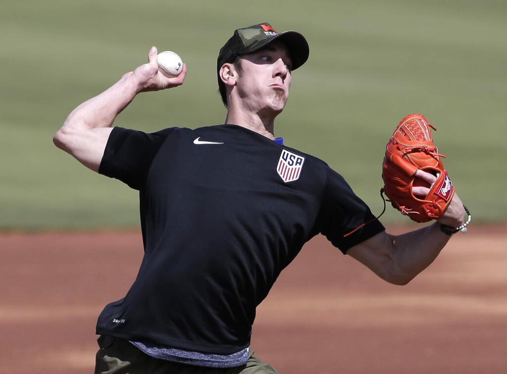 FILE - This May 6, 2016 file photo shows pitcher Tim Lincecum throwing for MLB baseball scouts at Scottsdale Stadium in Scottsdale, Ariz. The Los Angeles Angels are closing in on a deal to sign the two-time Cy Young Award winner, a free agent trying to come back from hip surgery, according to a person with knowledge of the negotiations, Monday, May 16, 2016. (AP Photo/Matt York, file)