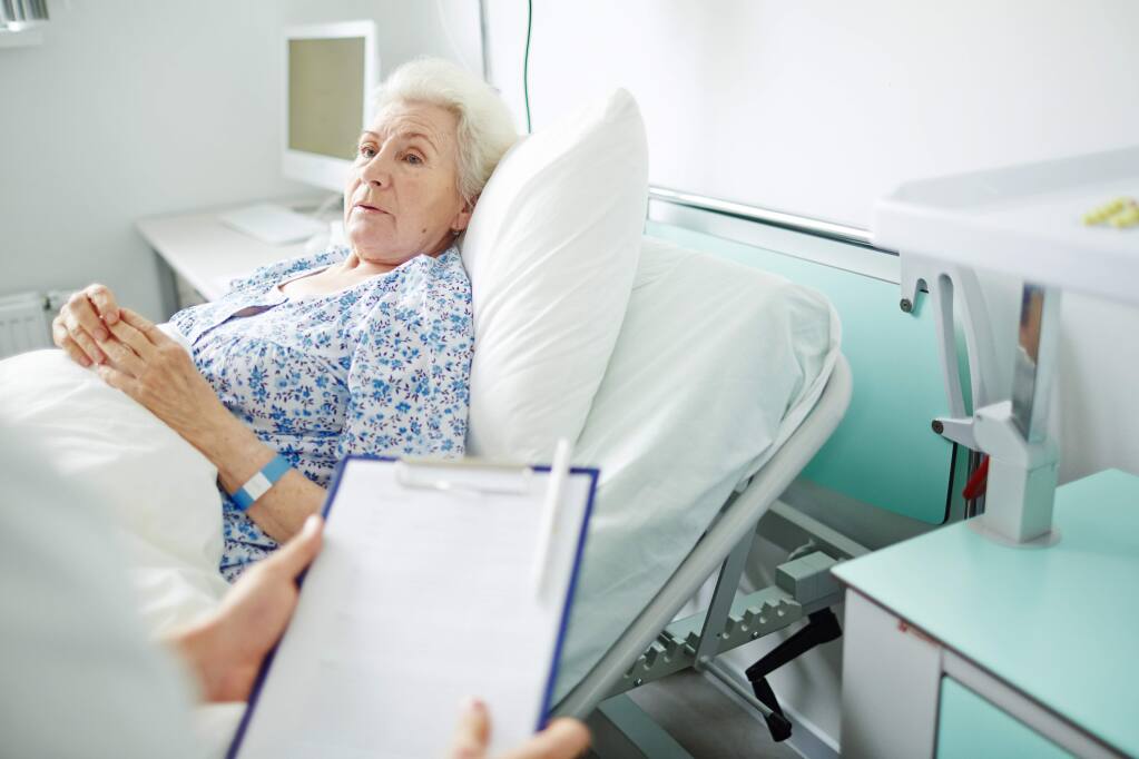 Experts say the threat of fines from government health care agencies is causing hospitals to be wary of letting elderly patient out of beds, delaying their recovery. (Shutterstock Photo)