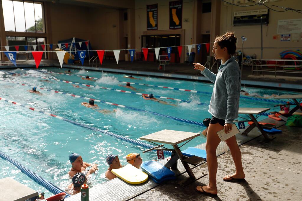 Olympic trials qualifier Maya DiRado, right, takes the SRJC swimming team through some world-class swim drills at Santa Rosa Junior College in Santa Rosa, California on Thursday, April 7, 2016. (Alvin Jornada / The Press Democrat)