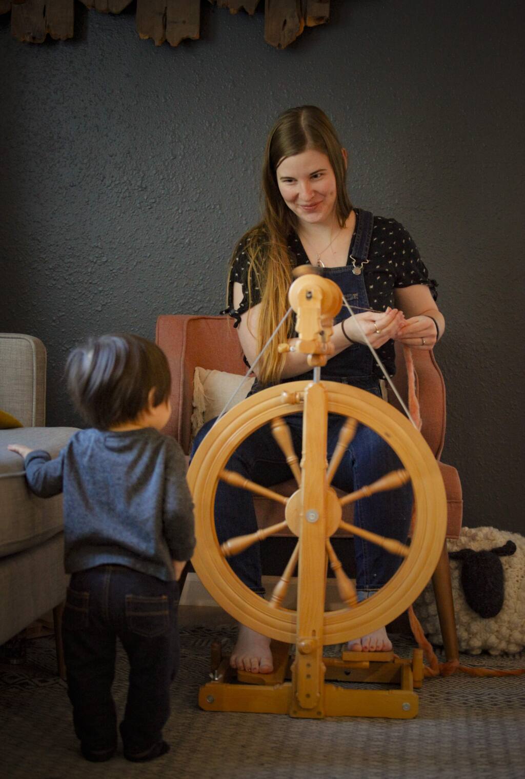 Petaluma, CA, USA. Tuesday, February 25, 2020._ Knitter Alisha Reyes opened Fiber Circle Studios in Cotati a few years ago. She teaches classes and creates indie dyed yarn in her studio where she is accompanied by her 11-month-old son, Dominic. (CRISSY PASCUAL/ARGUS-COURIER STAFF)