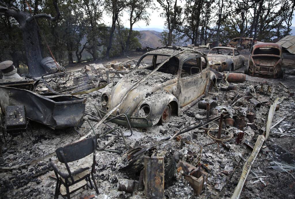 Burned vehicles on top of a ridge, north of Highway 20 near Clearlake Oaks, burned by the Rocky Fire, on Tuesday, August 4, 2015. (Christopher Chung/ The Press Democrat)