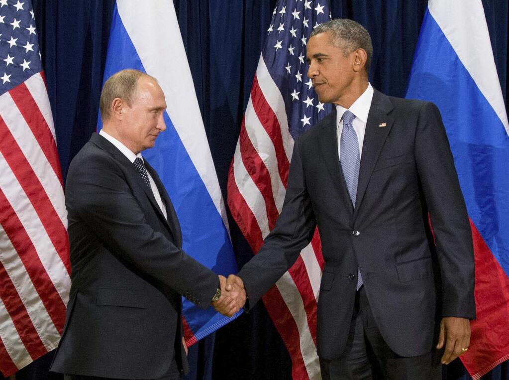 FILE - In this Sept. 28, 2015 file photo, President Barack Obama shakes hands with Russian President President Vladimir Putin before a bilateral meeting at United Nations headquarters. Obama has ordered intelligence officials to conduct a broad review on the election-season hacking that rattled the presidential campaign and raised new concerns about foreign meddling in U.S. elections, a White House official said Friday. White House counterterrorism and Homeland Security adviser Lisa Monaco said Obama ordered officials to report on the hacking of Democratic officials' email accounts and Russia's involvement. (AP Photo/Andrew Harnik, File)