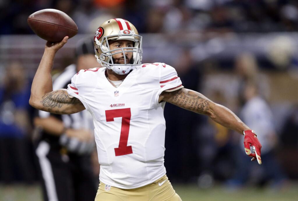 FILE - In this Nov. 1, 2015, file photo, San Francisco 49ers quarterback Colin Kaepernick throws during the first quarter of an NFL football game against the St. Louis Rams in St. Louis. (AP Photo/Tom Gannam, File)