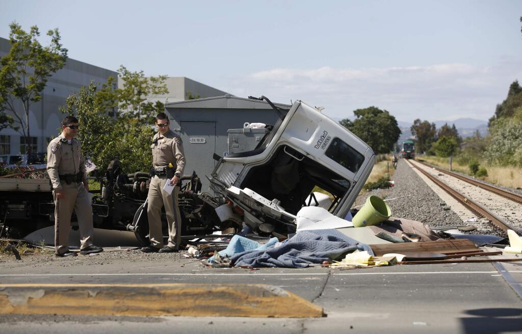 CHP officers investigate a collision between a SMART train and a truck at the Todd Road crossing near Santa Rosa on Thursday, May 31, 2018. (BETH SCHLANKER/ PD)