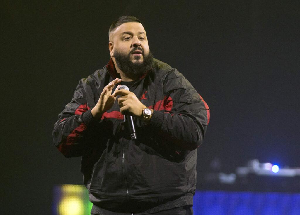 FILE - In this March 23, 2018 file photo, DJ Khaled performs as the opening act for Demi Lovato during her 'Tell Me You Love Me World Tour' in Philadelphia. Khaled is releasing a single with Nipsey Hussle that was filmed days before Hussle was shot to death in Los Angeles. Khaled announced on Twitter on Wednesday, May 15, 2019, that all proceeds from ‚ÄúHigher‚Äù will be donated to Hussle‚Äôs children, 10-year-old Emani and 2-year-old Kross. (Photo by Owen Sweeney/Invision/AP, File)
