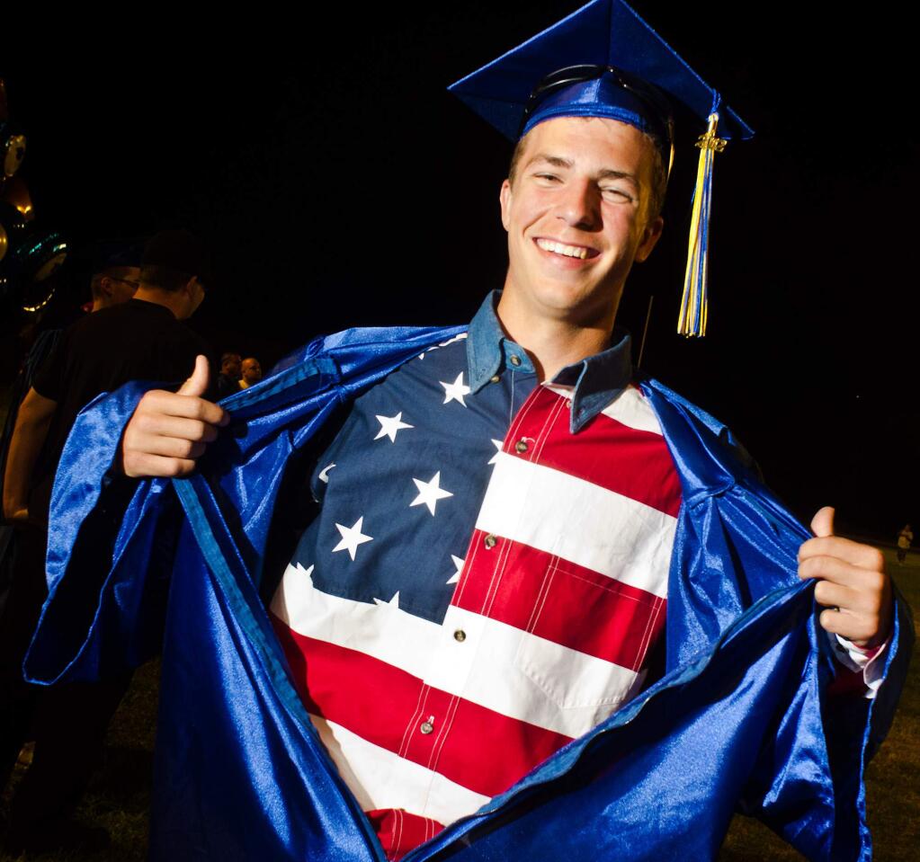 2012 Cloverdale High School graduate Tony Wilson shows his patriotism by wearing his American flag shirt underneath his graduation gown. (Photo by Alvin Jornada for The Press Democrat)
