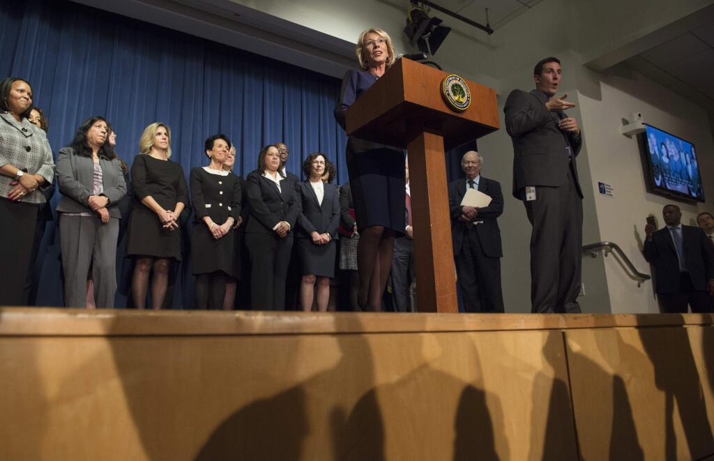 Education Secretary Betsy DeVos addresses Education Department staff, Wednesday, Feb. 8, 2017, at the Education Department in Washington. (AP Photo/Molly Riley)