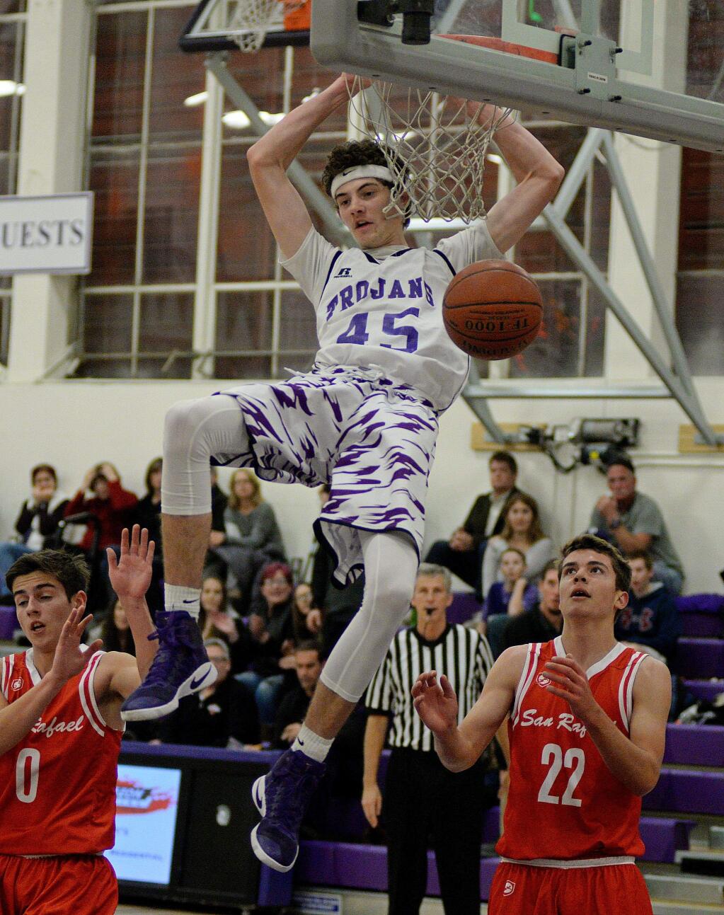 SUMNER FOWLER/FOR THE ARGUS-COURIERPetaluma's Joey Potts completes a slam against San Rafael. The senior is keeping his college options open.