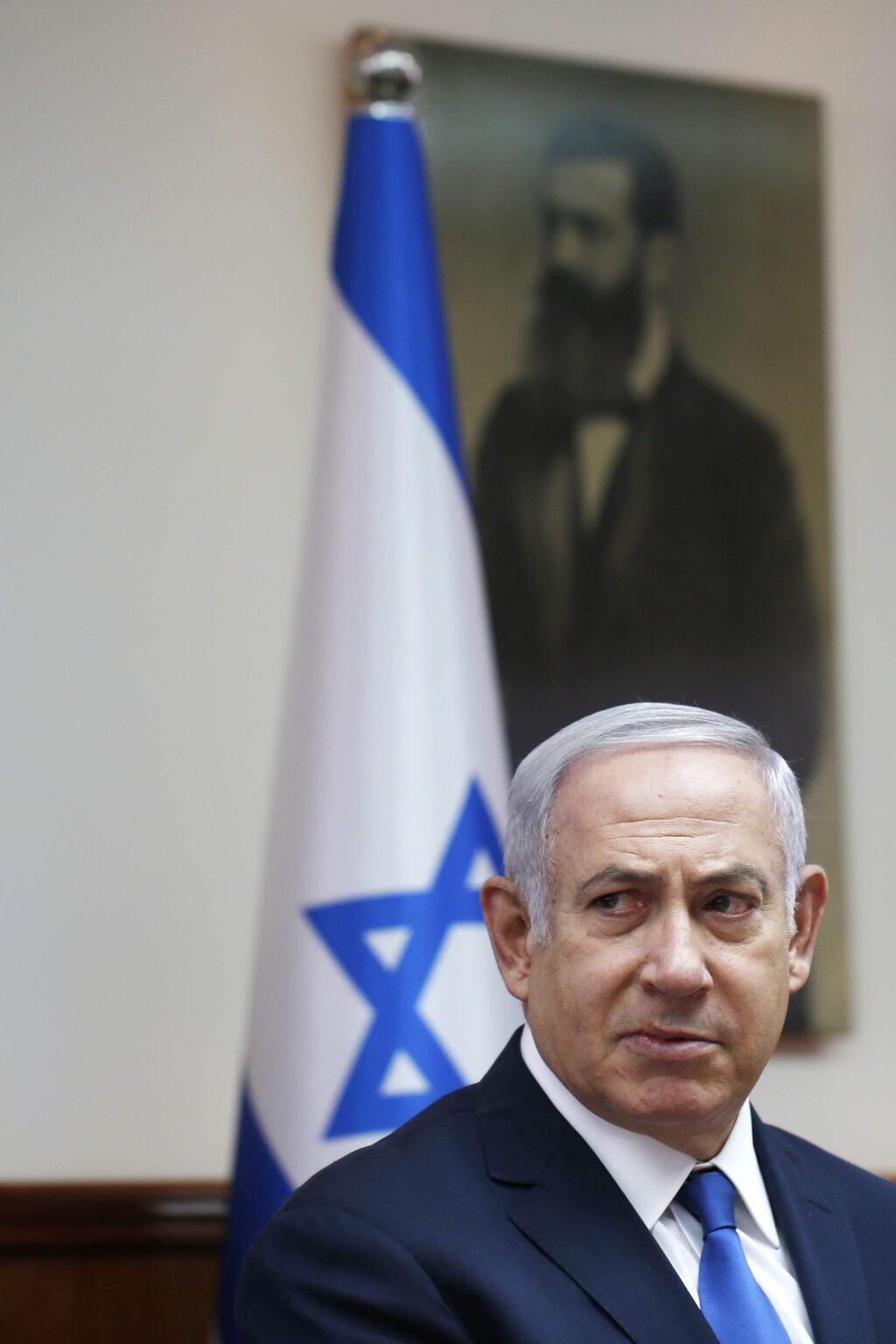 Israeli Prime Minister Benjamin Netanyahu chairs the weekly cabinet meeting at his office in Jerusalem, Sunday, July 15, 2018. (Ronen Zvulun/Pool via AP)