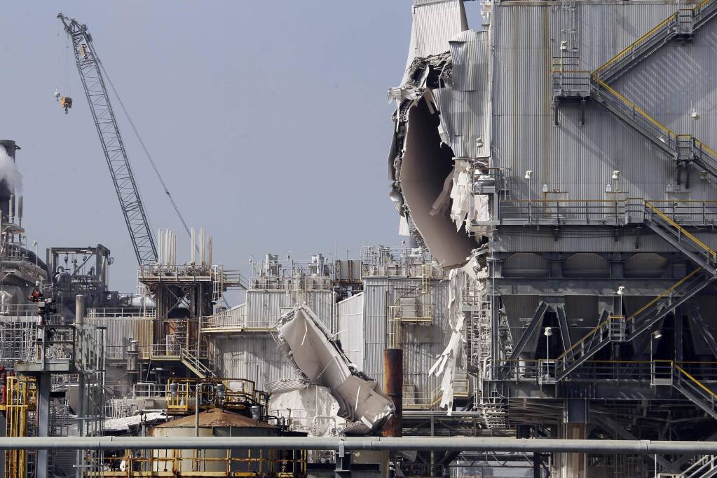 The ExxonMobil refinery is seen after an explosion in a gasoline processing unit at the facility, in Torrance, Calif., on Wednesday, Feb. 18, 2015. Two workers suffered minor injuries and a small fire at the unit was quickly put out. The incident triggered a safety flare to burn off flammable substances. The facility about 20 miles south of downtown Los Angeles covers 750 acres, employs over a thousand people, and processes an average of 155,000 barrels of crude oil per day, according to the company. (AP Photo/Nick Ut)
