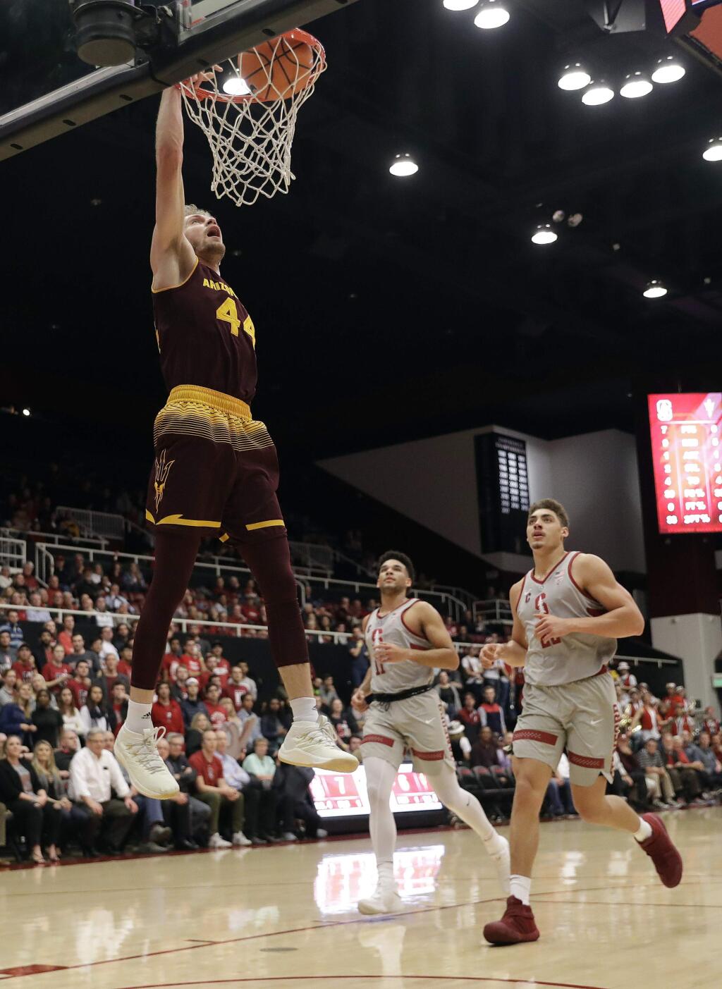 Arizona State guard Kodi Justice, top left, dunks against Stanford during the first half of an NCAA college basketball game Wednesday, Jan. 17, 2018, in Stanford, Calif. (AP Photo/Marcio Jose Sanchez)