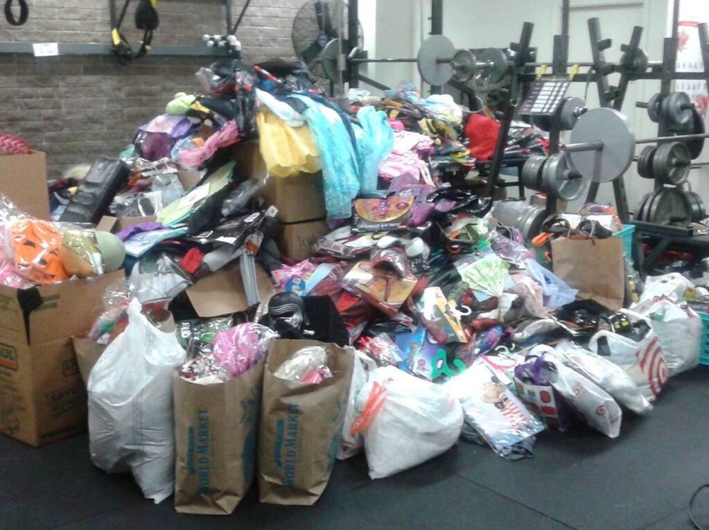 The pile of Halloween costumes donated to the Santa Rosa Police Department for kids displaced by the fire are shown in a Facebook post on Sunday, Oct. 22, 2017. (SANTA ROSA POLICE DEPARTMENT/ FACEBOOK)