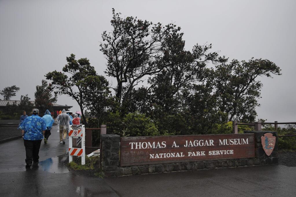 People visits the Jaggar Museum located near Kilauea's summit crater in Volcanoes National Park, Hawaii, Thursday, May 10, 2018. The park is closing Friday due to the threat of an explosive volcanic eruption. (AP Photo/Jae C. Hong)