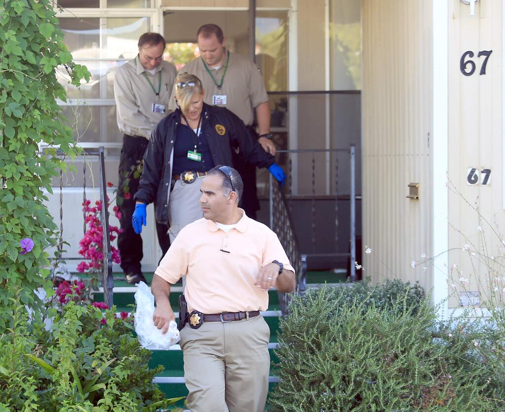 Law enforcement officials investigate a death at the Rincon Valley Mobile Estates in east Santa Rosa in 2013. (KENT PORTER/ PD FILE)