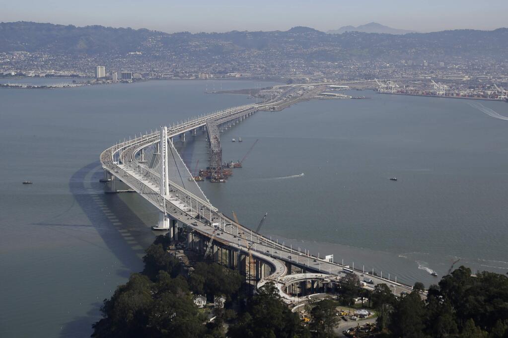 FILE - In this Feb. 5, 2016, file photo, the eastern section of the San Francisco-Oakland Bay Bridge is seen in San Francisco. It could cost $9 to cross the Oakland-San Francisco Bay Bridge if the region's voters approve toll increases to pay for transportation improvements in the notoriously gridlocked region. (AP Photo/Eric Risberg, file)