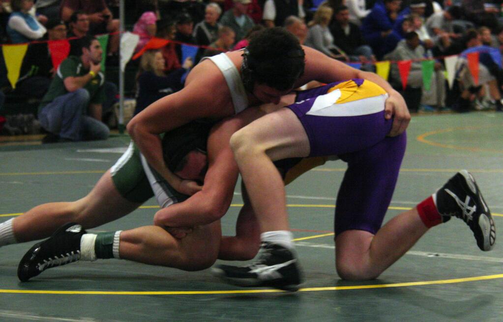 Steven Serafini/Index-Tribune Sonoma's Jake McDonald (top), in his first year of wrestling, and three Dragon teammates competed in Saturday's annual Green and Gold Tourney at San Marin in Novato.