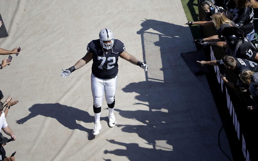 Oakland Raiders tackle Donald Penn is introduced before a game against the New York Jets in Oakland, Sunday, Sept. 17, 2017. (AP Photo/Jeff Chiu)