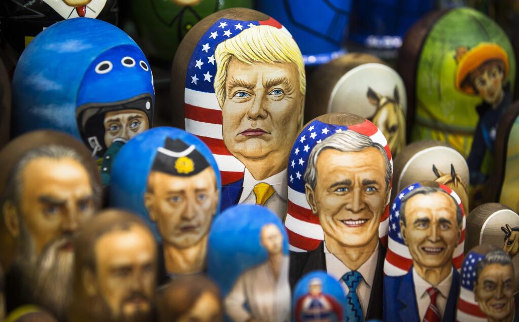 Matryoshkas, traditional Russian wooden dolls, including a doll of U.S. President Donald Trump, top, are displayed for sale in Moscow, Russia, Thursday, March 2, 2017. Trump has repeatedly said that he aims to improve relations with Russia, but Moscow appears frustrated by the lack of visible progress as well as by support from Trump Administration officials for continuing sanctions imposed on Russia for its interference in Ukraine. (AP Photo/Alexander Zemlianichenko)
