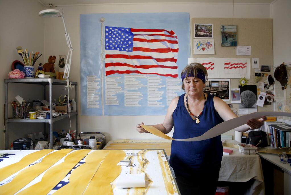 Artist Monica Bryant works on the art piece 'Citizenship Installation' that will be featured at Santa Rosa City Hall. Photo taken at her studio on Wednesday, July 27, 2016 in Santa Rosa, California . (BETH SCHLANKER/ The Press Democrat)