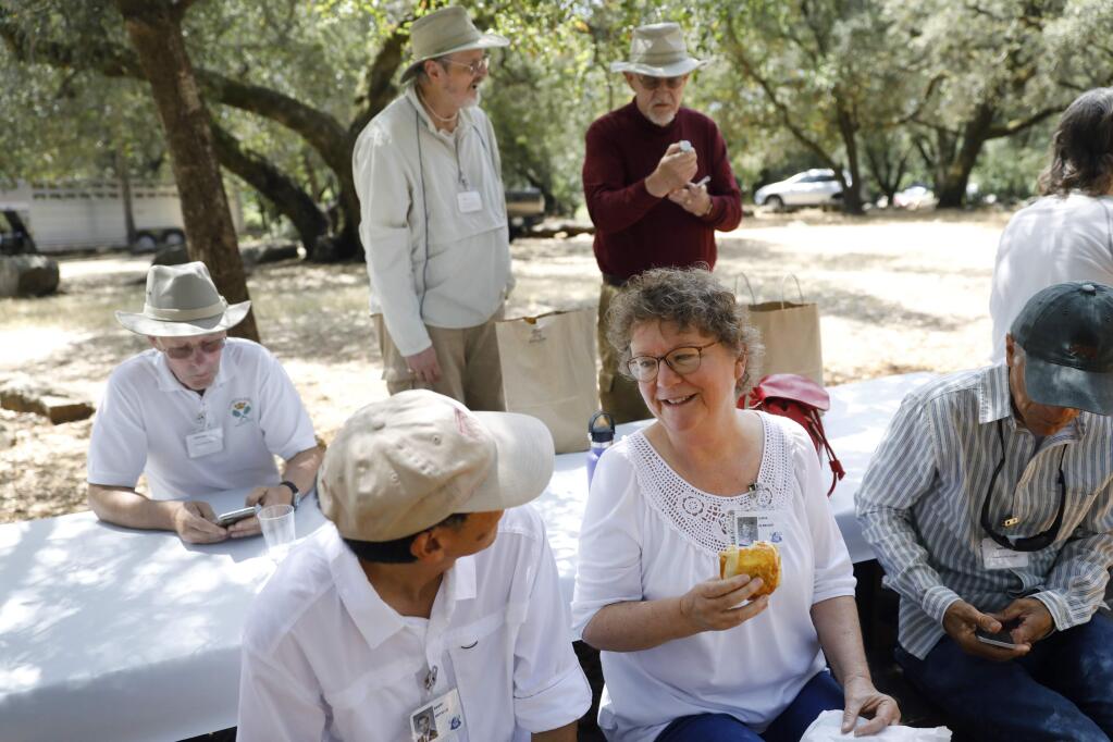 Linda Albright talks with David Hayashi during a picnic for the 50th anniversary of the Montgomery High School class of 1968 at Howarth Park on Sunday, July 22, 2018 in Santa Rosa, California . (BETH SCHLANKER/The Press Democrat)