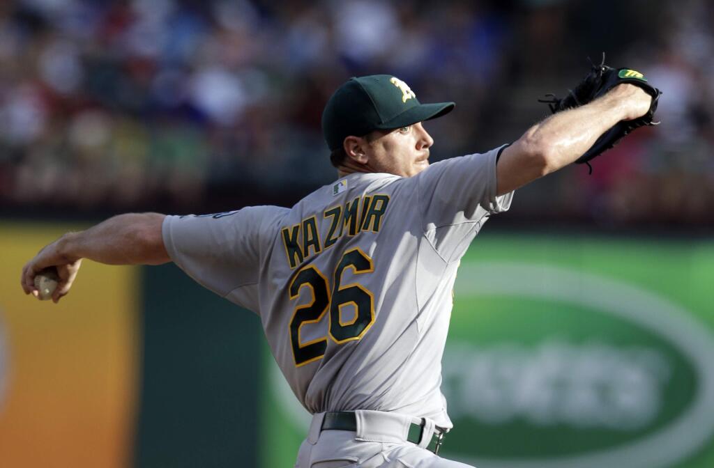 Oakland Athletics starting pitcher Scott Kazmir (26) works against the Texas Rangers in the first inning of a baseball game, Sunday, July 27, 2014, in Arlington, Texas. (AP Photo/Tony Gutierrez)