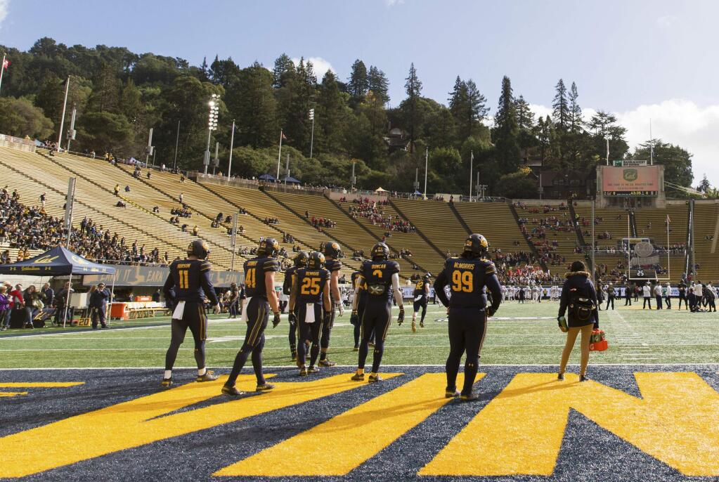 Cal players warm up before a game against the Stanford Cardinal in Berkeley, Saturday, Dec. 1, 2018. (AP Photo/John Hefti)