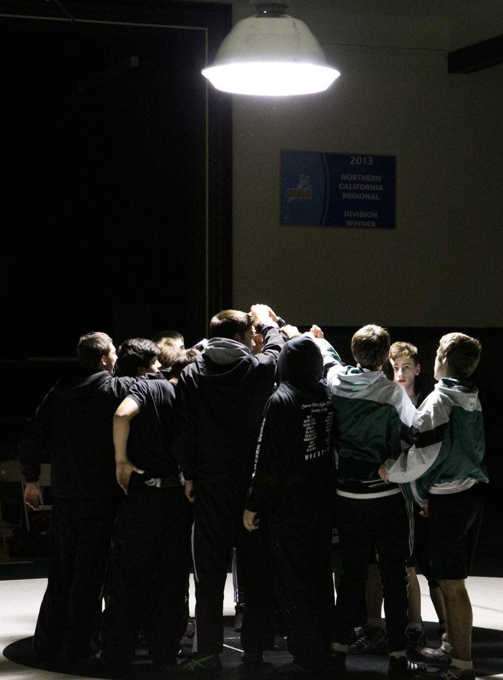 Sonoma Valley High wrestlers in their pre-meet huddle before a match against Healdsburg Wednesday night, Jan. 20, 2016, in Golton Hall. (Photo by Julie Vader/special to the Index-Tribune)