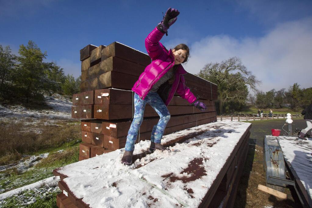 Olivia Hamilton, playing hooky from school on the morning of Feb. 5, slides on snow that fell overnight at Sugarloaf State Park in Kenwood on Tuesday, Feb. 5. (Photo by Robbi Pengelly/Index-Tribune)
